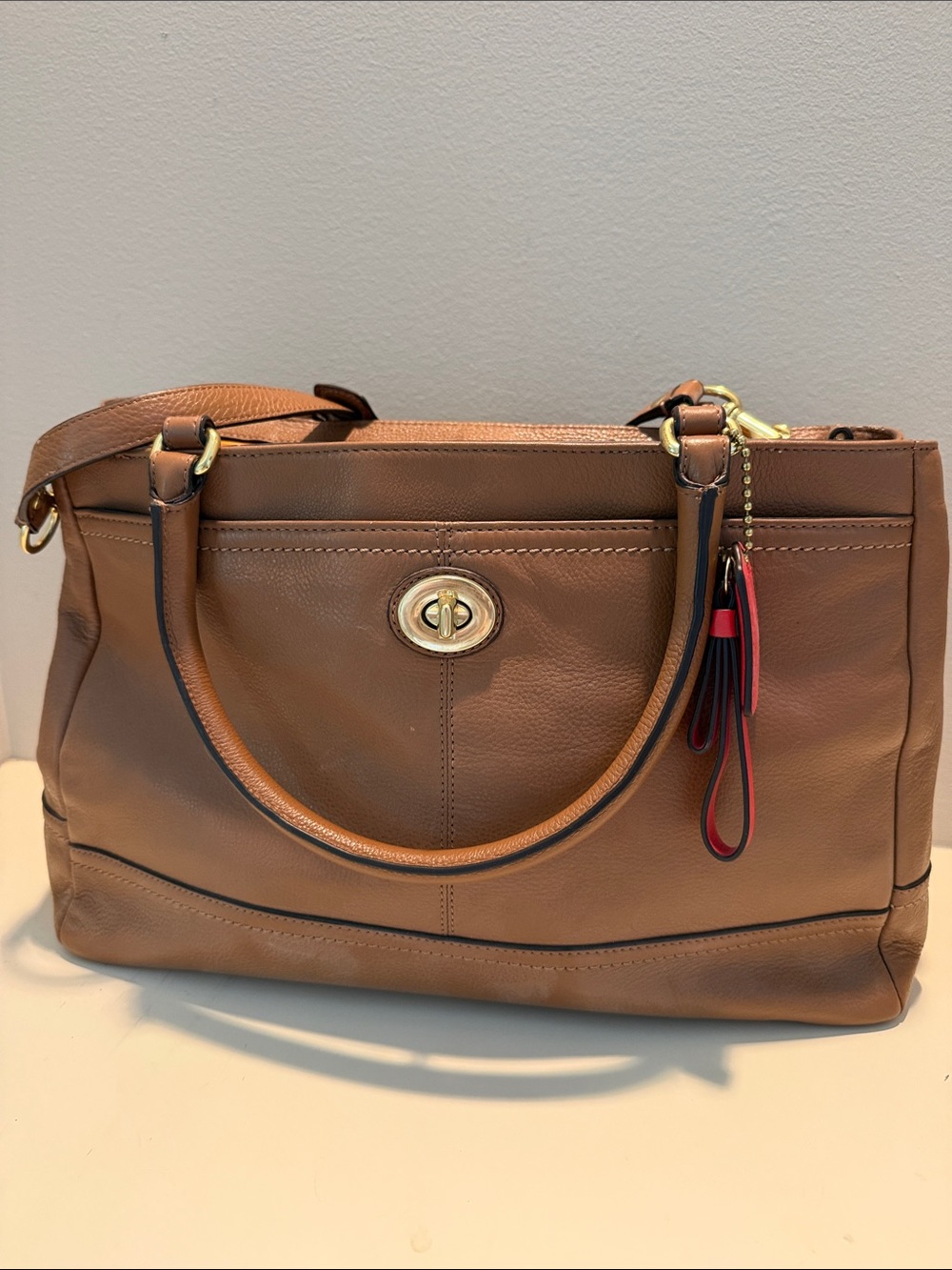Coach Brown Leather Satchel with Red Charm